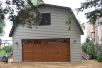 Clopay-Sectional-Garage-Door-Ultragrain-Gallery-Long-Carraige-Panel-1