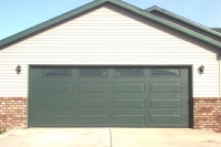 Haas-Sectional-Garage-Door-670-Hunter-Green-Sunburst-Window